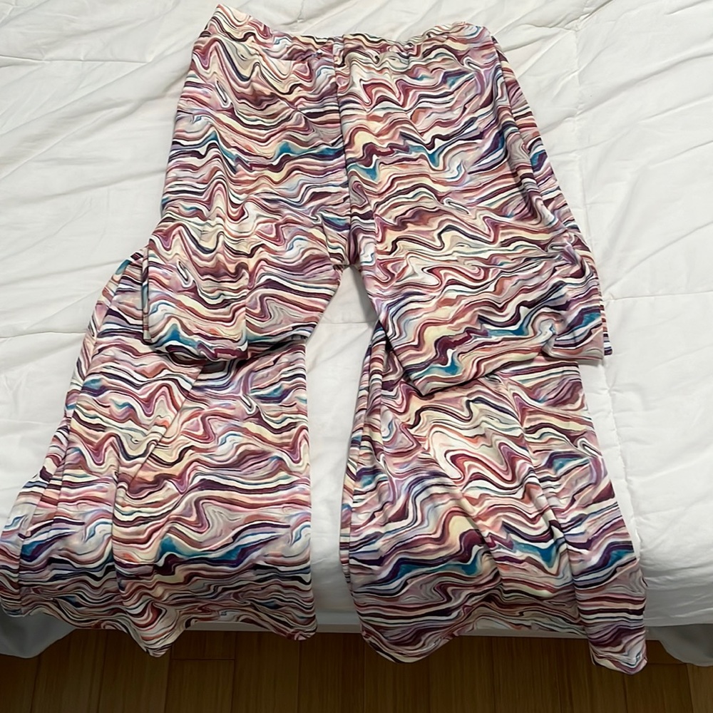 Elastic 90’s groovy pants! Size L but fits nice on my medium self. Is brand new!
